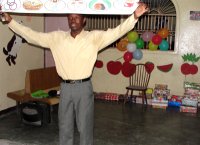 Seen here Pastor Banes the Kids' EE Haiti Director demonstrating the 'Gospel in a nutshell'. 