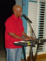 David Rowe leading praise and worship at St Gabrials School Barbados