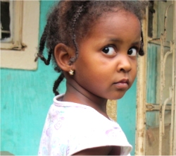 This little girl lives in the Orphanage in Uganda that United Caribbean Trust (UCT) is attempting to purchase.