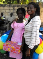 Greta distributing Make Jesus Smile shoeboxes in Haiti