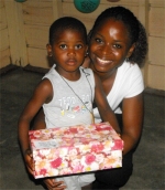 Kathy Ann Sanderford from New Dimensions Ministry in Barbados seen here distributing the Make Jesus Smile shoeboxes.