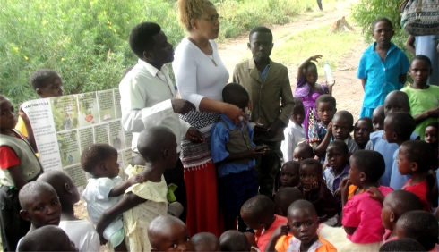 Lisa planting the Jesus seed in child evangelism on the mountain at Nyangrongo Full Gospel church