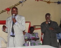 Bishop addressing the Beni, DR Congo Woman's Convention  with Pastor Abraham