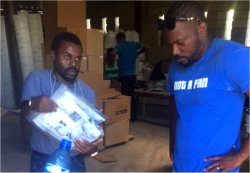 The team collecting the 450 filters from the Sawyer PointOne water filter depo in Port au Prince en route to Jacmel.