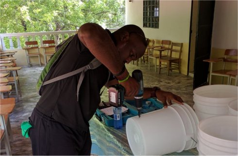 United Caribbean Trust Mission trip to help survivors of Hurricane Matthew in Haiti with Sawyer filtered clean water as fears of an increase in cholera cases grow
