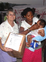 Jenny Tryhane, Founder of UCT in Haiti distributing a box in one of the tent cities.