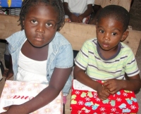 Children from a small Haitian church receiving thier Make Jesus Smile shoeboxes. 