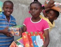 The Make Jesus Smile shoebox distribution took place outdoors at the Church of God school in Les Cayes.