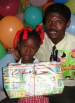 Seen here one of the little girls from Bethesda school in Les Cayes, Haiti receiving one of the Charles F Broome Primary School Make Jesus Smile shoeboxes shortly after the Haiti <a href=