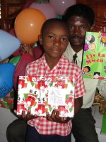 Child at Bethesda school receiving his gift