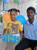 Kids' EE Haiti director distributing Make Jesus Smile shoeboxes