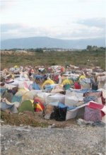 Most people in Port au Prince continue to sleep under tents, tarps or sheets.
