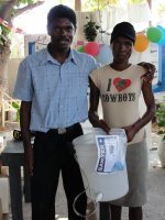 Pastor Pierre Banes Laurore, the Kids' EE Haiti Director seen here in YWAM in Gonaive documenting the Sawyer PointONE water filter distribution.