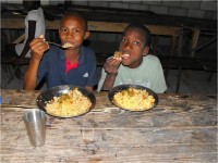 HaitiOne partnering with United Caribbean Trust feeding children in Haiti physically and Spiritually