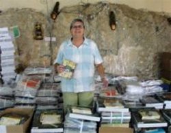 Jenny Tryhane founder of United Caribbean Trust unpacking Love Packages donated to Mount Zion Missin International church