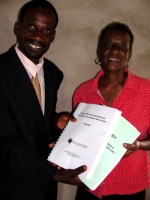 Seen here receiving her KIMI curriculum and Manual from Pastor William the Uilwa KIMI Coordinator.