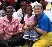 Pastor Enid seen here with Jenny and her little girl Loveness.