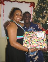 Seen here the children  receiving their Make Jesus Smile Christmas shoebox gifts packed by the children of Barbados.