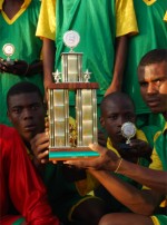 Football the champions in Hati with their trophy donated by Sewing World Barbados