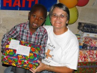 Jenny Tryhane distributing the Make Jesus Smile shoeboxes