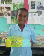 Barbadian school children packing  shoe boxes for the children on the Caribbean