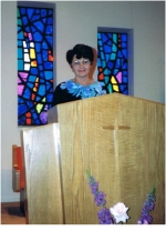 Peggy giving her testimony in the chapel