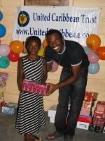 Imran Richards representing the Wesleyan Holiness church in Barbados seen here distributing the Make Jesus Smile shoeboxes.