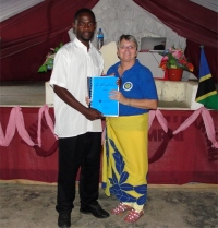 Seen here receiving his KIMI manual and curriculum from Jenny Tryhane, founder of UCT and a KIMI leadership trainer. 