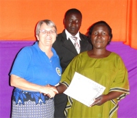 Bishop and his wife receiving their KIMI certificates at the end of the Tunduma KIMI PowerClub Leadership Training March 2011.