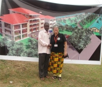 Seen here with Pastor Abraham, the UCT Uganda representative at Prayer Mountain for all Nations in front of their vision for a Prayer Village.