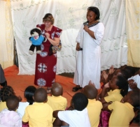 Pastor Martina translating for Pastor Laura as she brought the Word on Sunday at the CEPCI church in Kampala. 