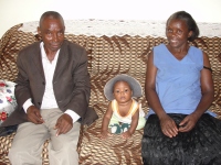 His mother and father with thier grandson