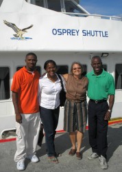 Pastor Steve Skeete, Jenny Tryhane and Margaret Agar with Pastor Happy on the dock in Carriacou.