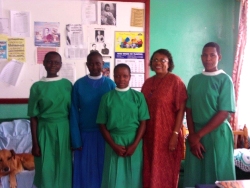 Dr Veronica with some of the 
                    girls at Christ the Kings school in Kalisizo<