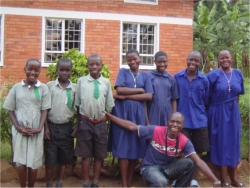 Seen here Mathius Luwaga with the pupils of the Nazareth Primary School.