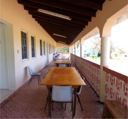 The large veranda stretches the full length of the building and is a pleasant place to sit and relax.